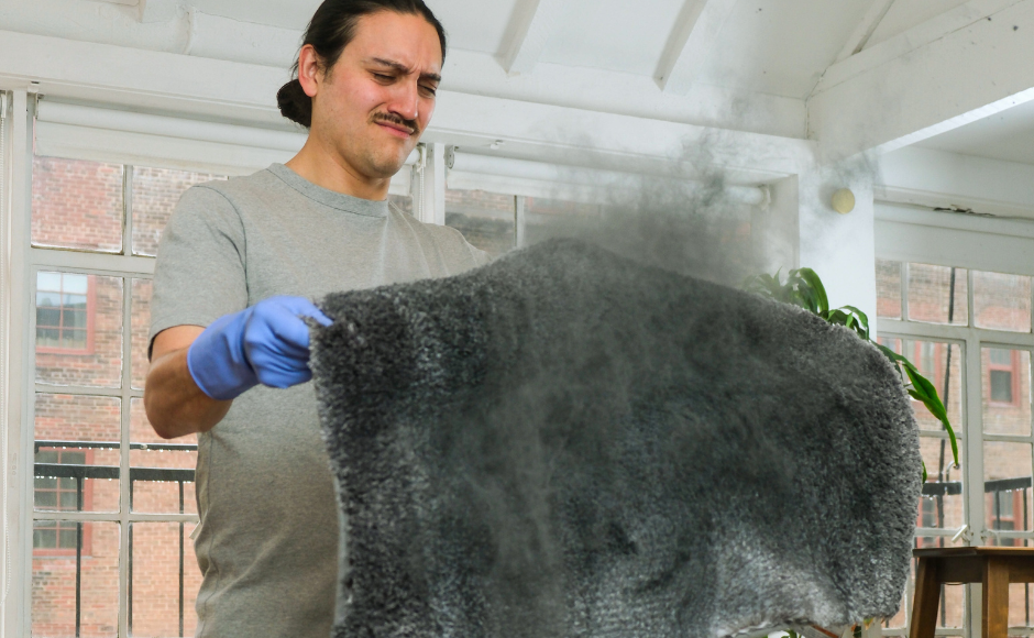 Man dealing with dust on carpet Sad woman cleaning